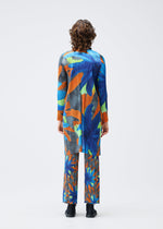 A model wears the PLEATS PLEASE ISSEY MIYAKE CARNIVAL coat.