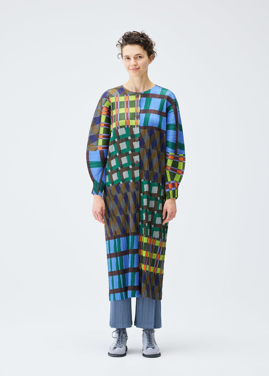 A model wears the PLEATS PLEASE ISSEY MIYAKE HARMONY clothing.
