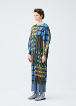 A model wears the PLEATS PLEASE ISSEY MIYAKE HARMONY clothing.