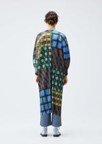 A model wears the PLEATS PLEASE ISSEY MIYAKE HARMONY clothing.