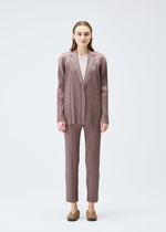 A model wears the PLEATS PLEASE ISSEY MIYAKE PLEATS JACKET jacket.