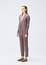 A model wears the PLEATS PLEASE ISSEY MIYAKE PLEATS JACKET jacket.