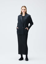 A model wears the PLEATS PLEASE ISSEY MIYAKE PLEATS JACKET jacket.