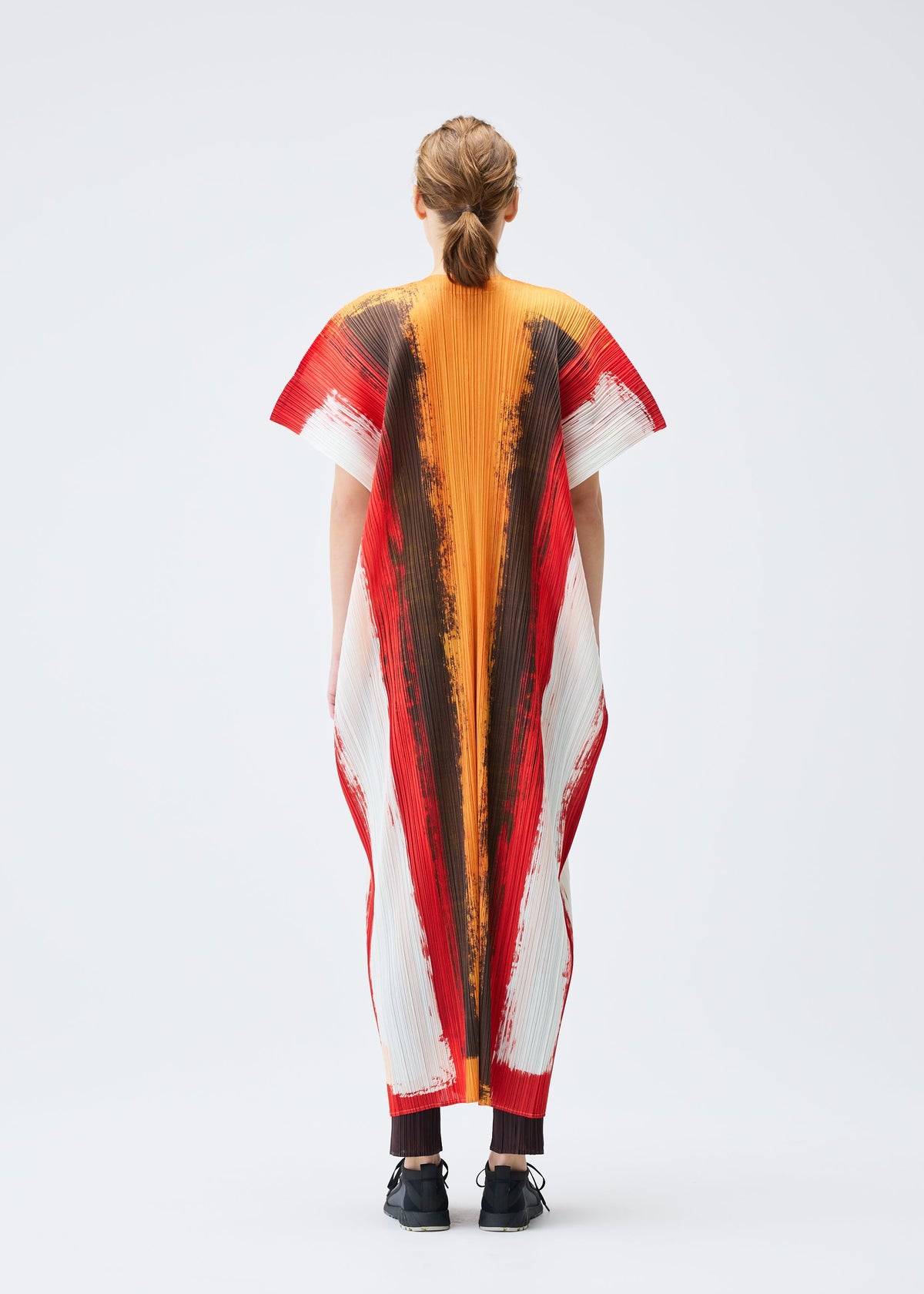 A model wears the PLEATS PLEASE ISSEY MIYAKE JUMP vest.