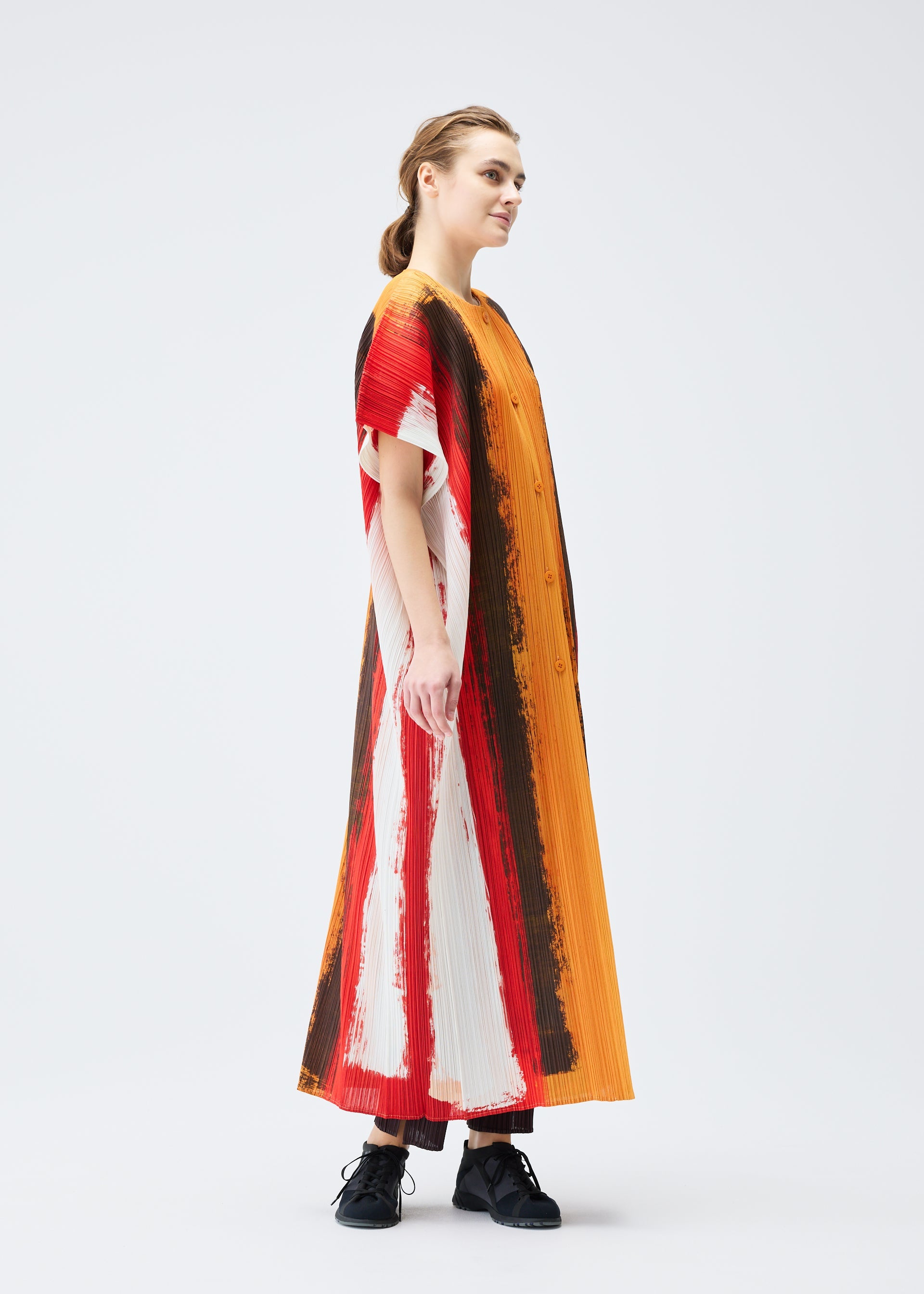 A model wears the PLEATS PLEASE ISSEY MIYAKE JUMP vest.