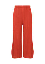 A product shot of the PLEATS PLEASE ISSEY MIYAKE MONTHLY COLORS JULY trousers in bright red.
