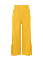 A product shot of the PLEATS PLEASE ISSEY MIYAKE MONTHLY COLORS JULY trousers in yellow.
