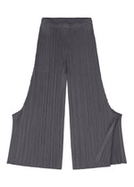 A detail shot of the PLEATS PLEASE ISSEY MIYAKE MONTHLY COLORS JULY trousers.