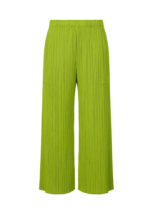 A product shot of the PLEATS PLEASE ISSEY MIYAKE MONTHLY COLORS AUGUST trousers in yellow green (58).