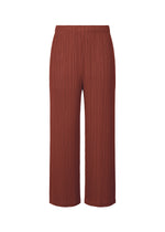A product shot of the PLEATS PLEASE ISSEY MIYAKE MONTHLY COLORS OCTOBER trousers in brown red (45).
