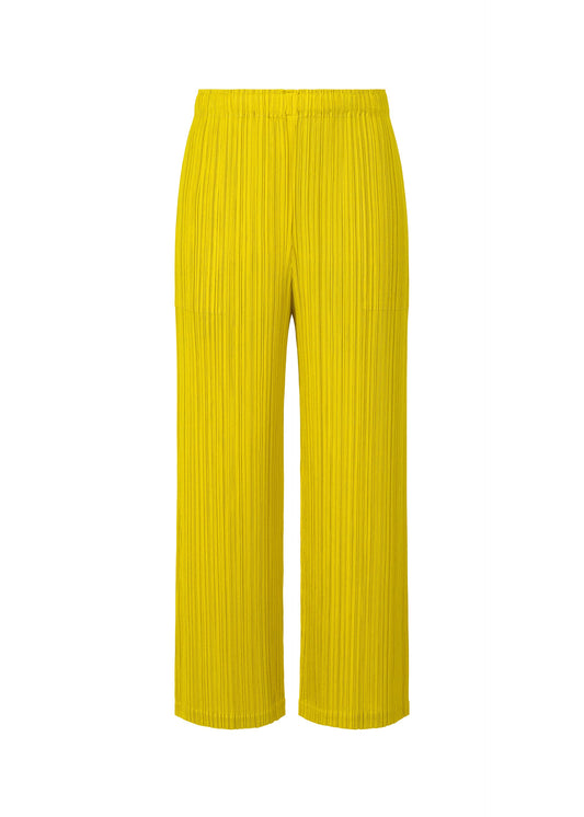 A product shot of the PLEATS PLEASE ISSEY MIYAKE MONTHLY COLORS OCTOBER trousers in canary yellow (51).