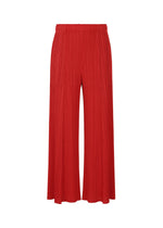 A product shot of the PLEATS PLEASE ISSEY MIYAKE MONTHLY COLORS NOVEMBER trousers in red (24).