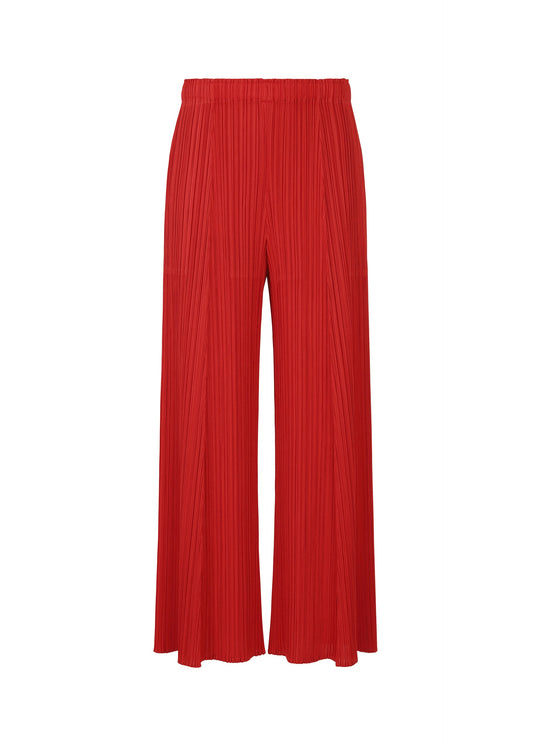 A product shot of the PLEATS PLEASE ISSEY MIYAKE MONTHLY COLORS NOVEMBER trousers in red (24).