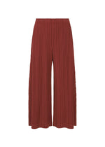 A product shot of the PLEATS PLEASE ISSEY MIYAKE WOOL PLEATS trousers in brown red (45).