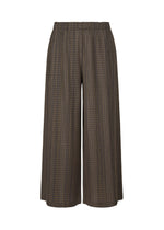 A product shot of the PLEATS PLEASE ISSEY MIYAKE COTTON SKIP trousers in dark brown.