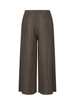 A detail shot of the PLEATS PLEASE ISSEY MIYAKE COTTON SKIP trousers.