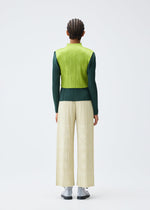 A model wears the PLEATS PLEASE ISSEY MIYAKE TUNE clothing.