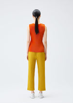 A model wears the PLEATS PLEASE ISSEY MIYAKE THICKER BOTTOMS 1 trousers.