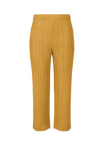 A product shot of the PLEATS PLEASE ISSEY MIYAKE THICKER BOTTOMS 1 trousers in mustard.