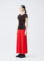 A model wears the PLEATS PLEASE ISSEY MIYAKE THICKER BOTTOMS 1 trousers.