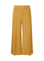 A product shot of the PLEATS PLEASE ISSEY MIYAKE THICKER BOTTOMS 1 trousers in mustard.