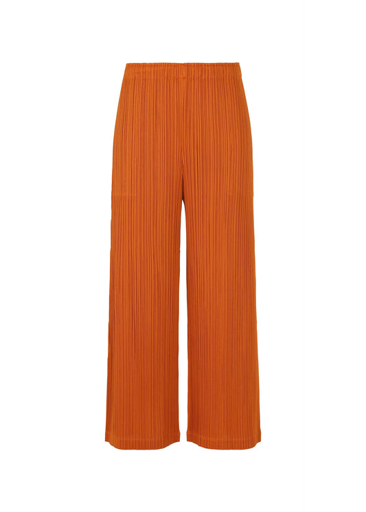 A product shot of the PLEATS PLEASE ISSEY MIYAKE LOOP BOTTOMS clothing in dark orange (33).