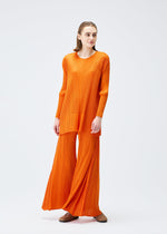 A model wears the PLEATS PLEASE ISSEY MIYAKE EFFICIENT SQUARE 2 clothing.