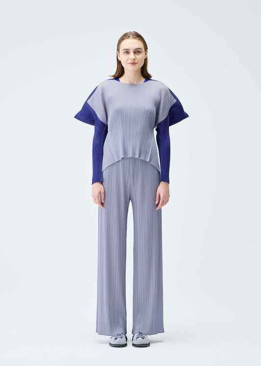 A model wears the PLEATS PLEASE ISSEY MIYAKE SQUARE trousers.