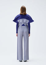A model wears the PLEATS PLEASE ISSEY MIYAKE SQUARE trousers.