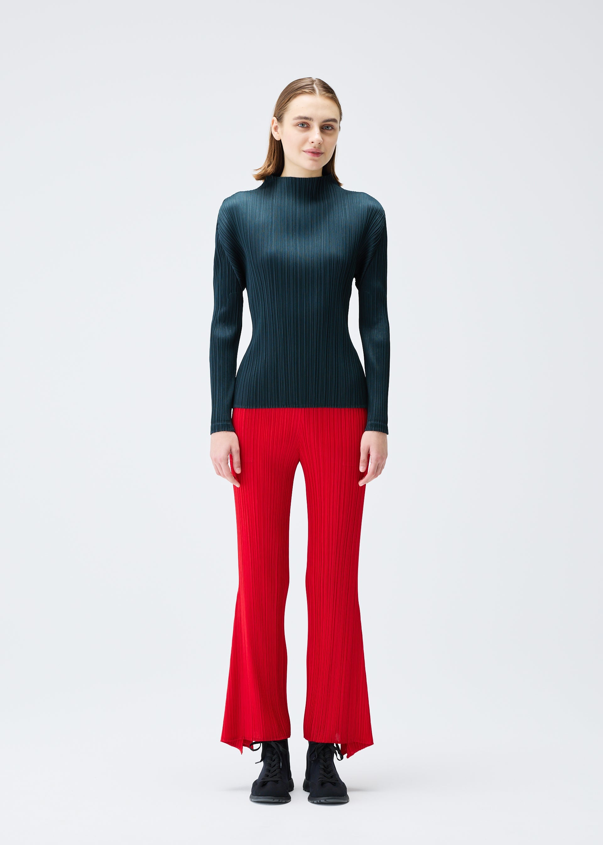 A model wears the PLEATS PLEASE ISSEY MIYAKE OLE! clothing.
