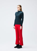A model wears the PLEATS PLEASE ISSEY MIYAKE OLE! clothing.