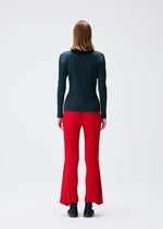A model wears the PLEATS PLEASE ISSEY MIYAKE OLE! clothing.