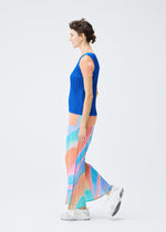 A model wears the PLEATS PLEASE ISSEY MIYAKE GROOVE trousers.