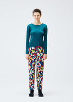 A model wears the PLEATS PLEASE ISSEY MIYAKE DANCING SQUARE trousers.