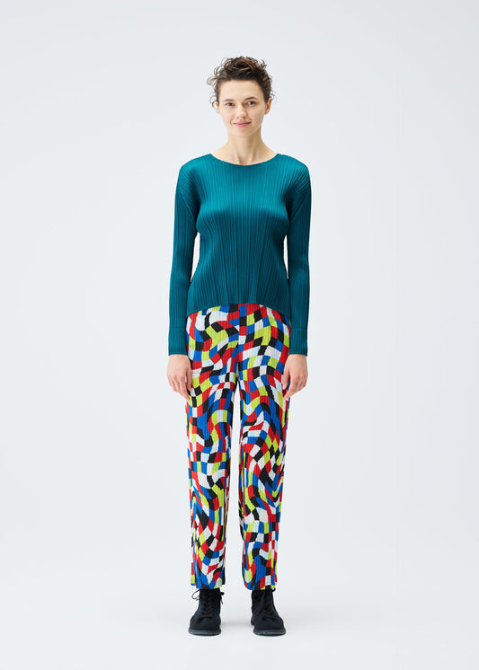 A model wears the PLEATS PLEASE ISSEY MIYAKE DANCING SQUARE trousers.