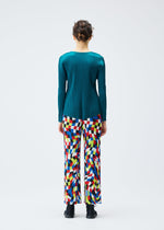 A model wears the PLEATS PLEASE ISSEY MIYAKE DANCING SQUARE trousers.