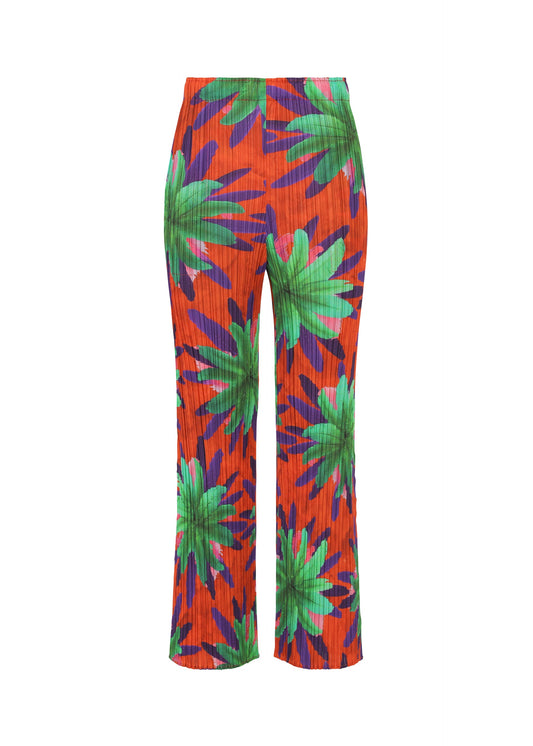 A product shot of the PLEATS PLEASE ISSEY MIYAKE CARNIVAL trousers in red (24).