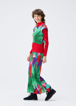 A model wears the PLEATS PLEASE ISSEY MIYAKE CARNIVAL trousers.