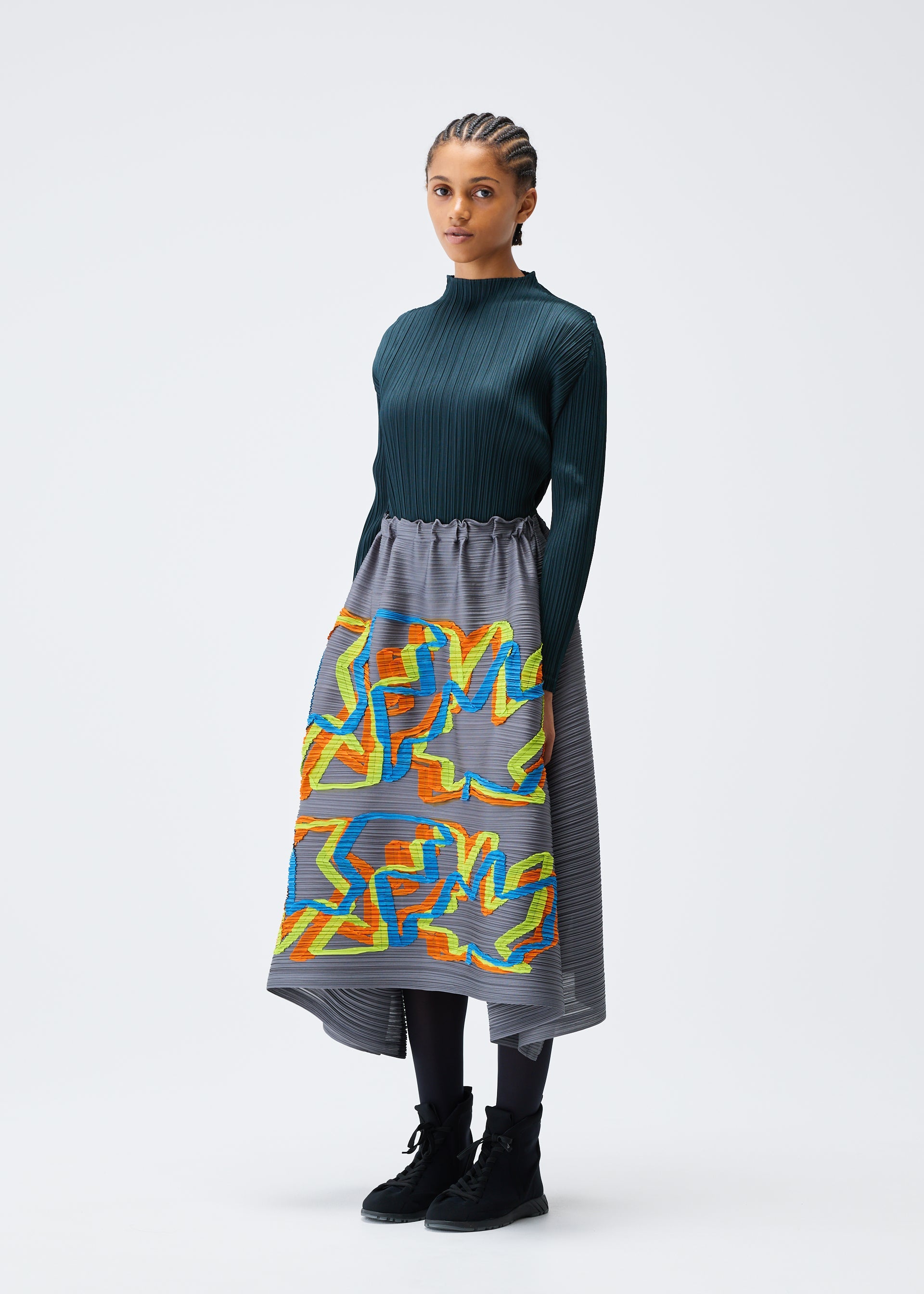 A model wears the PLEATS PLEASE ISSEY MIYAKE MIX skirt.
