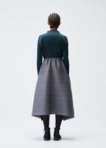 A model wears the PLEATS PLEASE ISSEY MIYAKE MIX skirt.