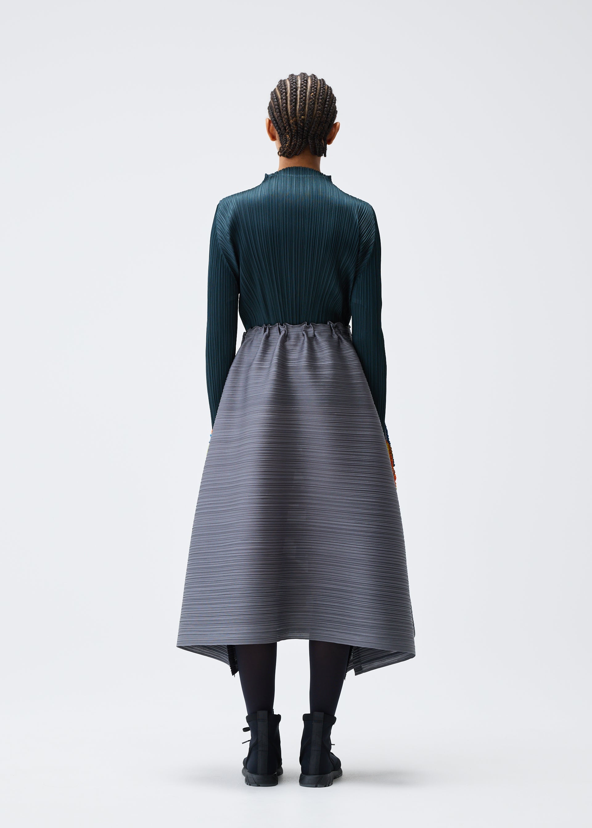 A model wears the PLEATS PLEASE ISSEY MIYAKE MIX skirt.