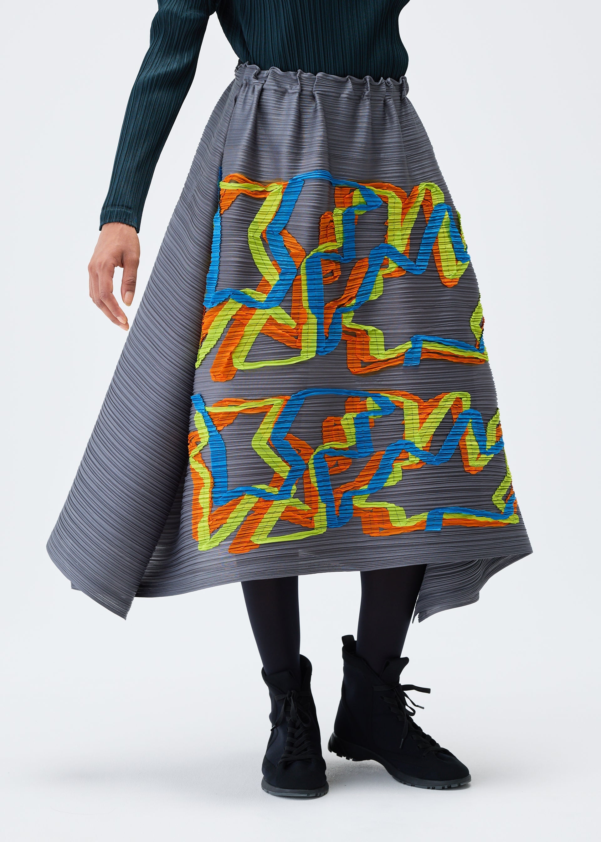 A model wears the PLEATS PLEASE ISSEY MIYAKE MIX skirt.