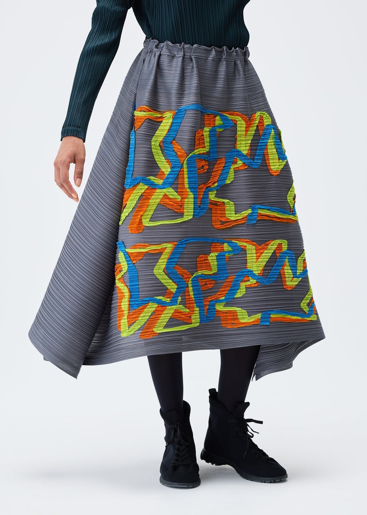 A model wears the PLEATS PLEASE ISSEY MIYAKE MIX skirt.