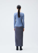 A model wears the PLEATS PLEASE ISSEY MIYAKE LOOP BOTTOMS clothing.