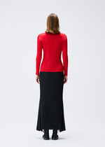 A model wears the PLEATS PLEASE ISSEY MIYAKE OLE! clothing.