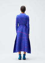 A model wears the PLEATS PLEASE ISSEY MIYAKE PAUSE skirt.