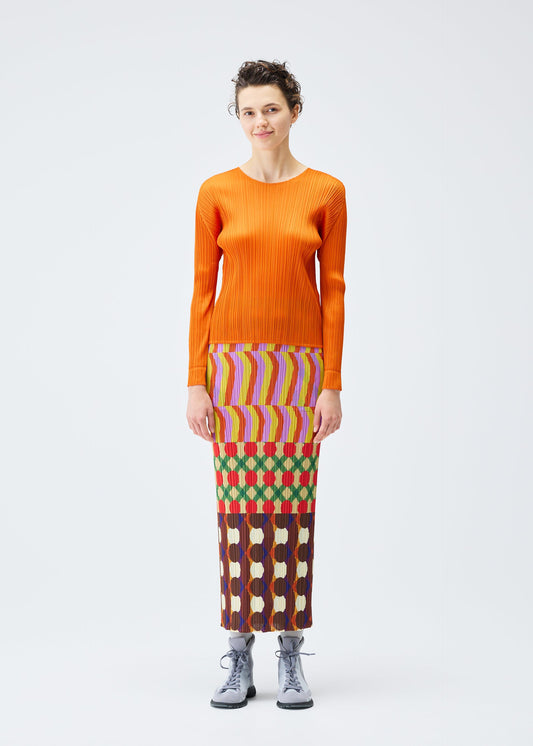 A model wears the PLEATS PLEASE ISSEY MIYAKE HARMONY clothing.