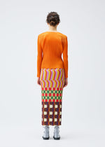A model wears the PLEATS PLEASE ISSEY MIYAKE HARMONY clothing.