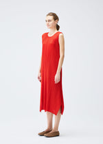 A model wears the PLEATS PLEASE ISSEY MIYAKE MONTHLY COLORS JULY dress.