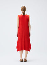 A model wears the PLEATS PLEASE ISSEY MIYAKE MONTHLY COLORS JULY dress.